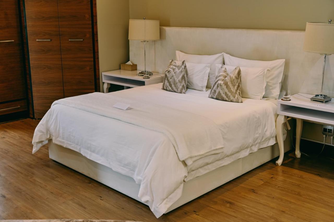 Tredenham Boutique Hotel Bloemfontein Exteriör bild A bed