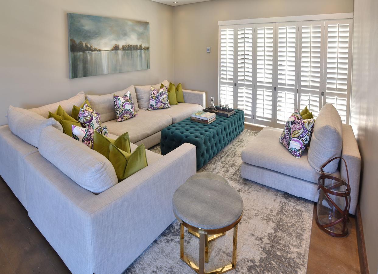 Tredenham Boutique Hotel Bloemfontein Exteriör bild A living room with plantation shutters